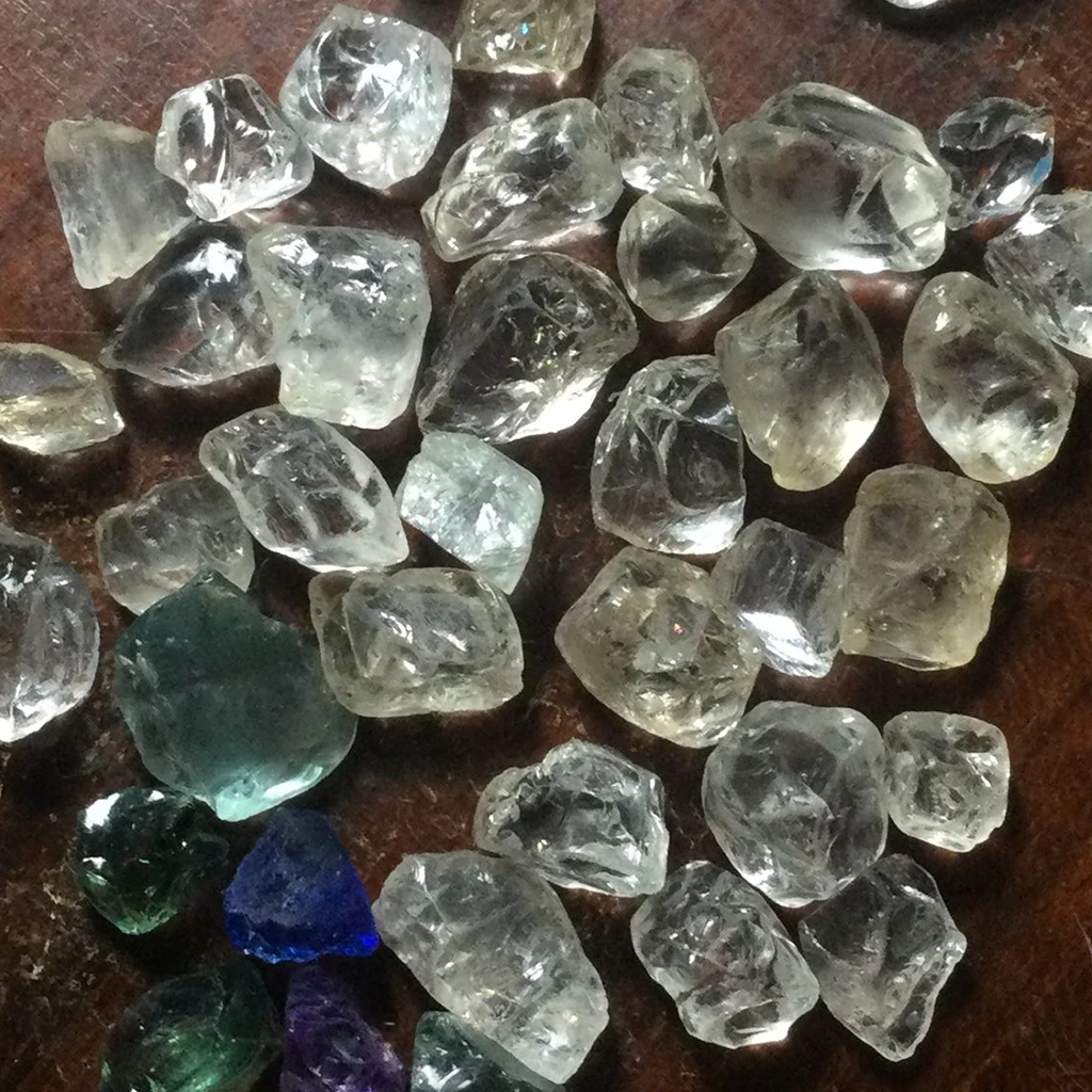 Ethically sourced certified diamonds from Africa, available in raw and cut variations with 4Cs grading